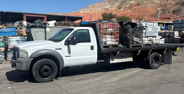 Flatbed truck loaded with heavy scrap metal